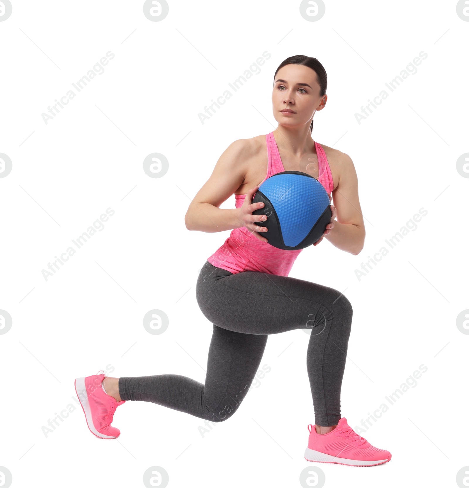 Athletic woman exercising with medicine ball on white background Photo of Athletic woman exercising with medicine ball on white background