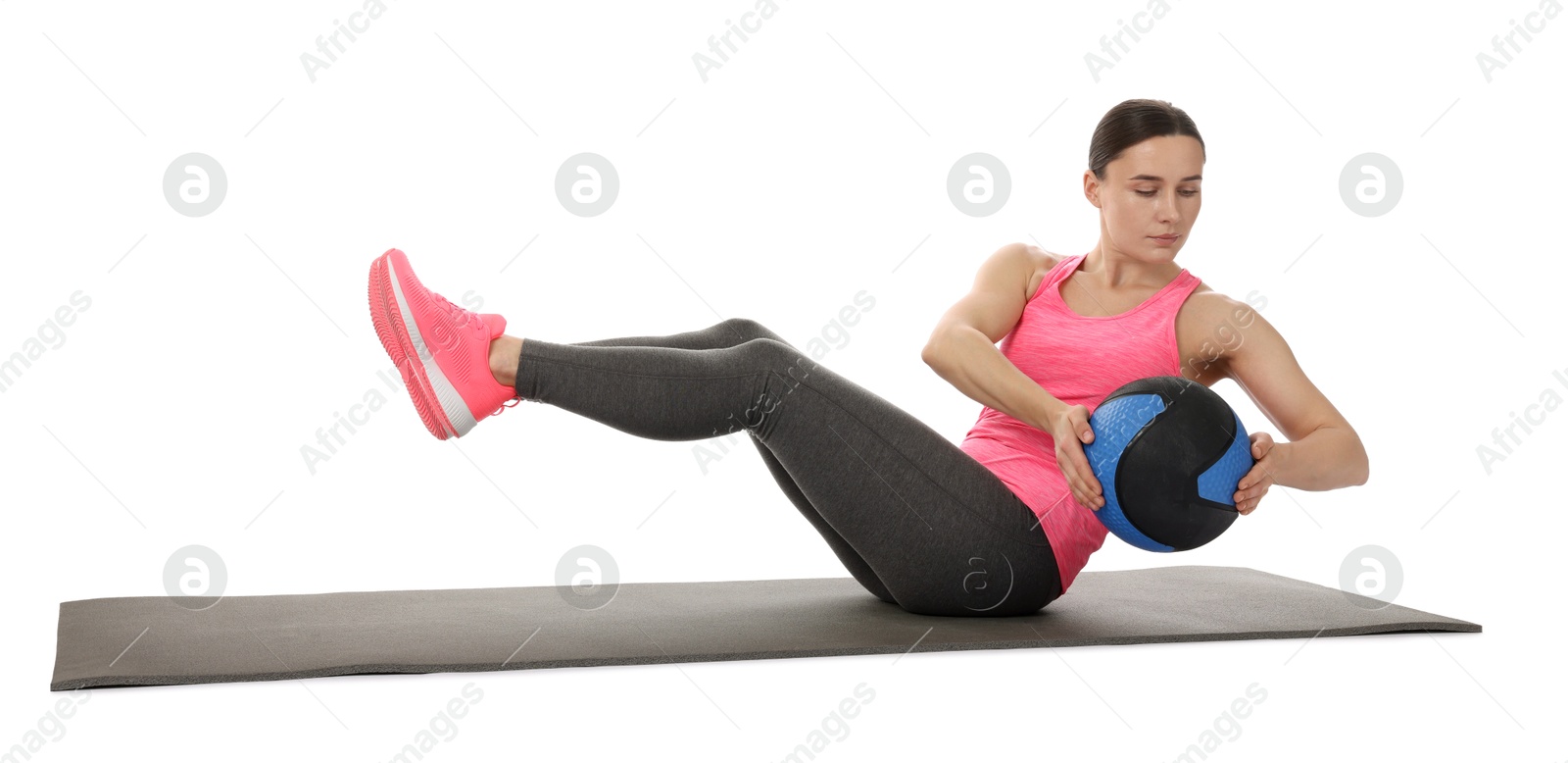 Athletic woman exercising with medicine ball on white background Photo of Athletic woman exercising with medicine ball on white background