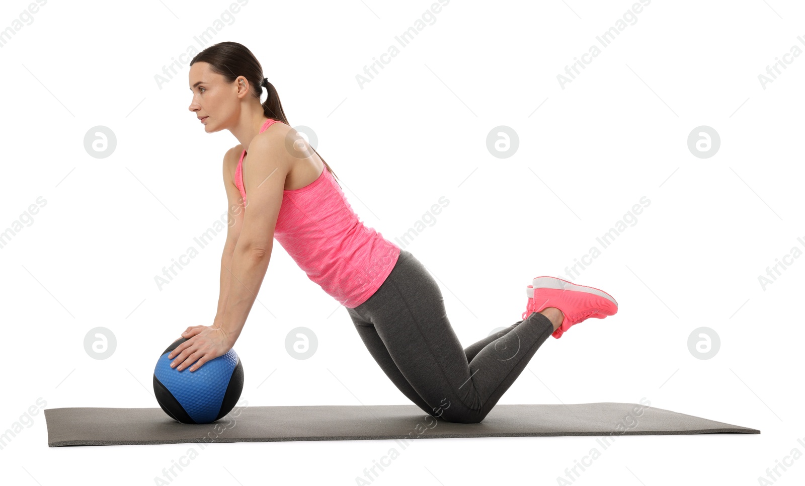 Athletic woman exercising with medicine ball on white background Photo of Athletic woman exercising with medicine ball on white background
