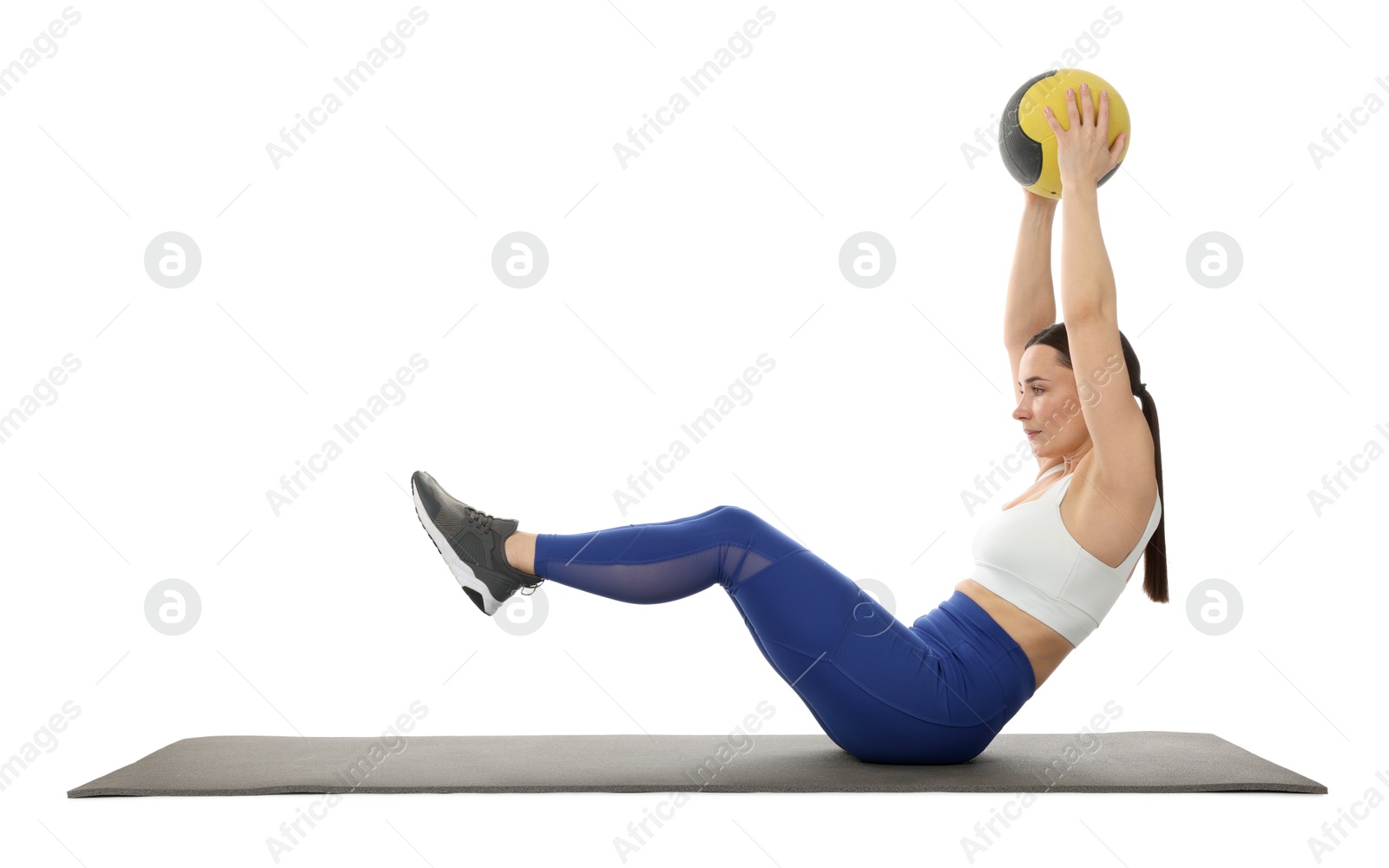 Athletic woman exercising with medicine ball on white background Photo of Athletic woman exercising with medicine ball on white background