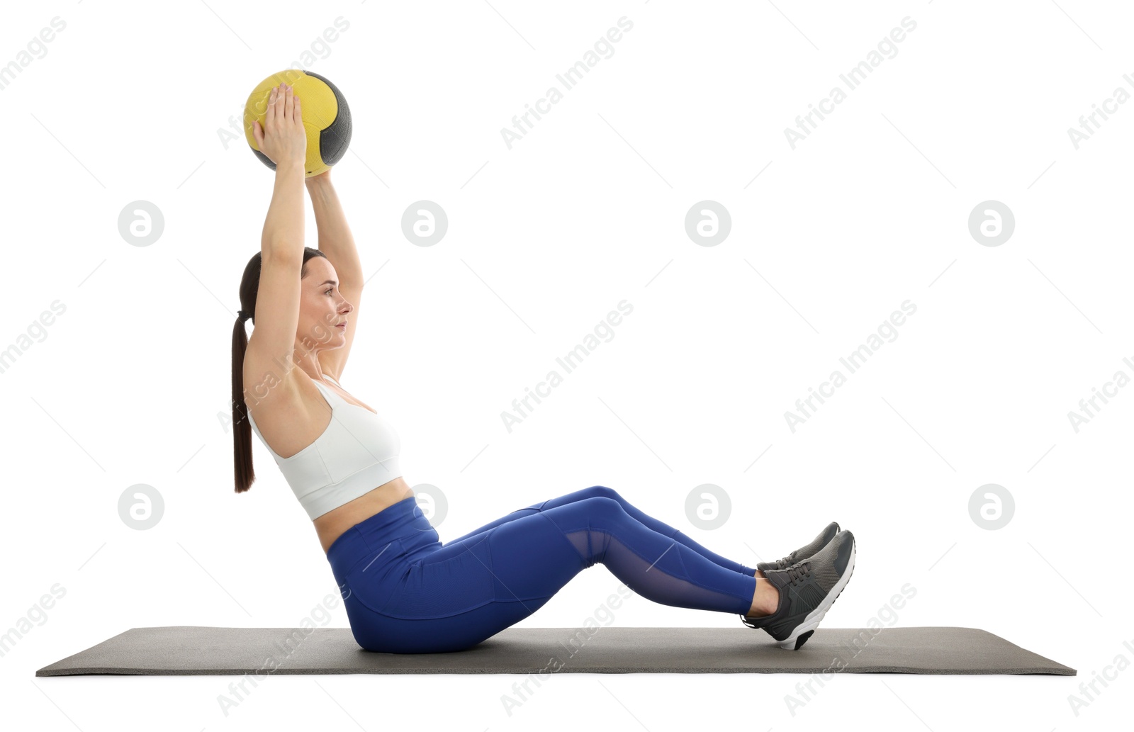 Athletic woman exercising with medicine ball on white background Photo of Athletic woman exercising with medicine ball on white background