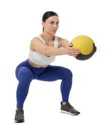 Photo of Athletic woman exercising with medicine ball on white background