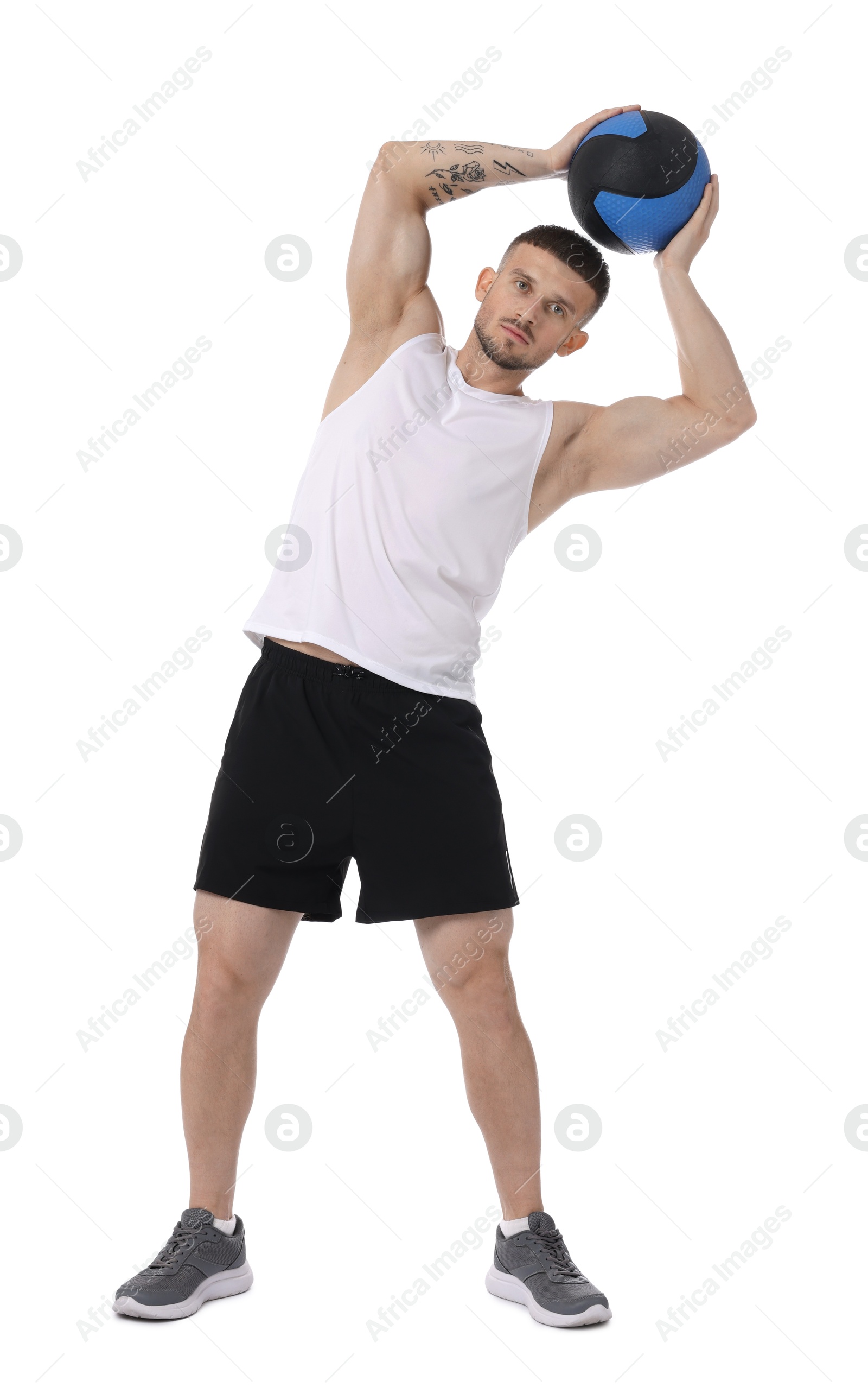 Man exercising with medicine ball on white background Photo of Man exercising with medicine ball on white background