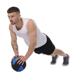 Photo of Man exercising with medicine ball on white background