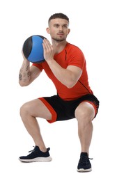 Photo of Man exercising with medicine ball on white background