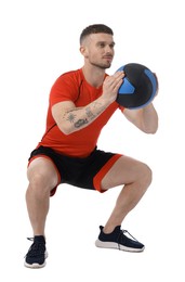 Photo of Man exercising with medicine ball on white background