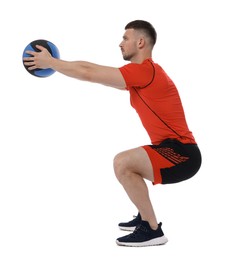 Photo of Man exercising with medicine ball on white background