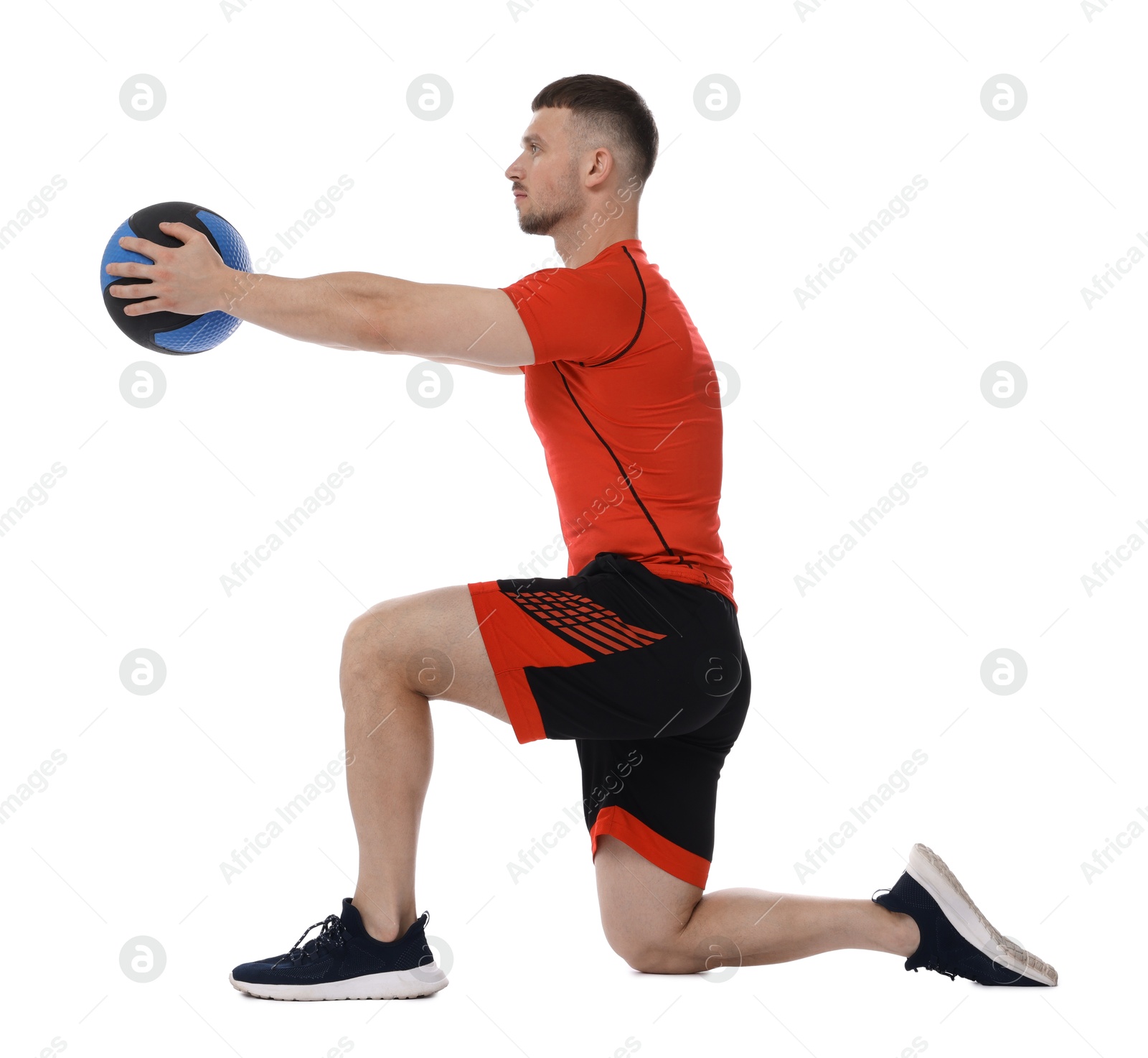 Man exercising with medicine ball on white background Photo of Man exercising with medicine ball on white background
