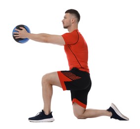 Photo of Man exercising with medicine ball on white background