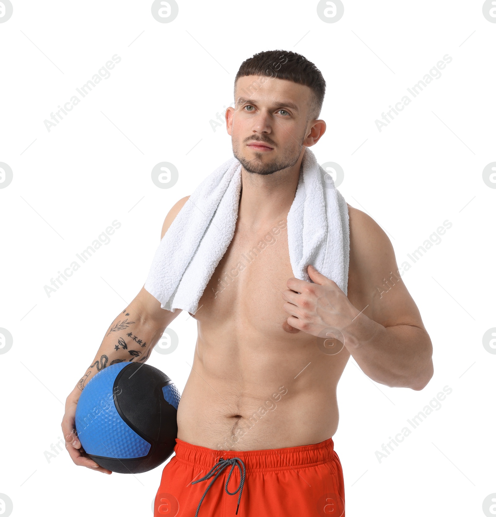 Man with medicine ball and towel on white background Photo of Man with medicine ball and towel on white background