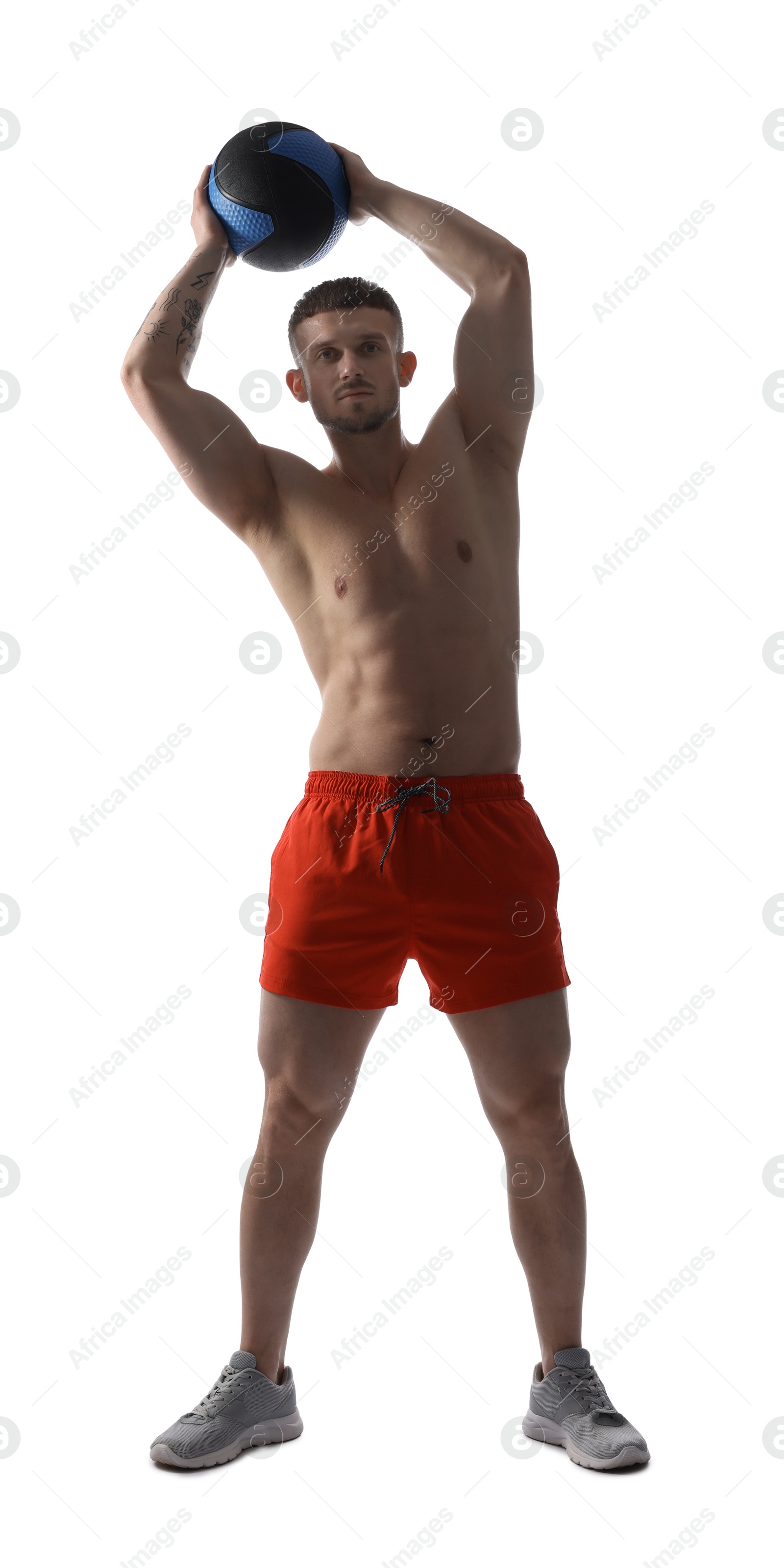 Man exercising with medicine ball on white background Photo of Man exercising with medicine ball on white background