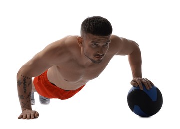 Photo of Man exercising with medicine ball on white background