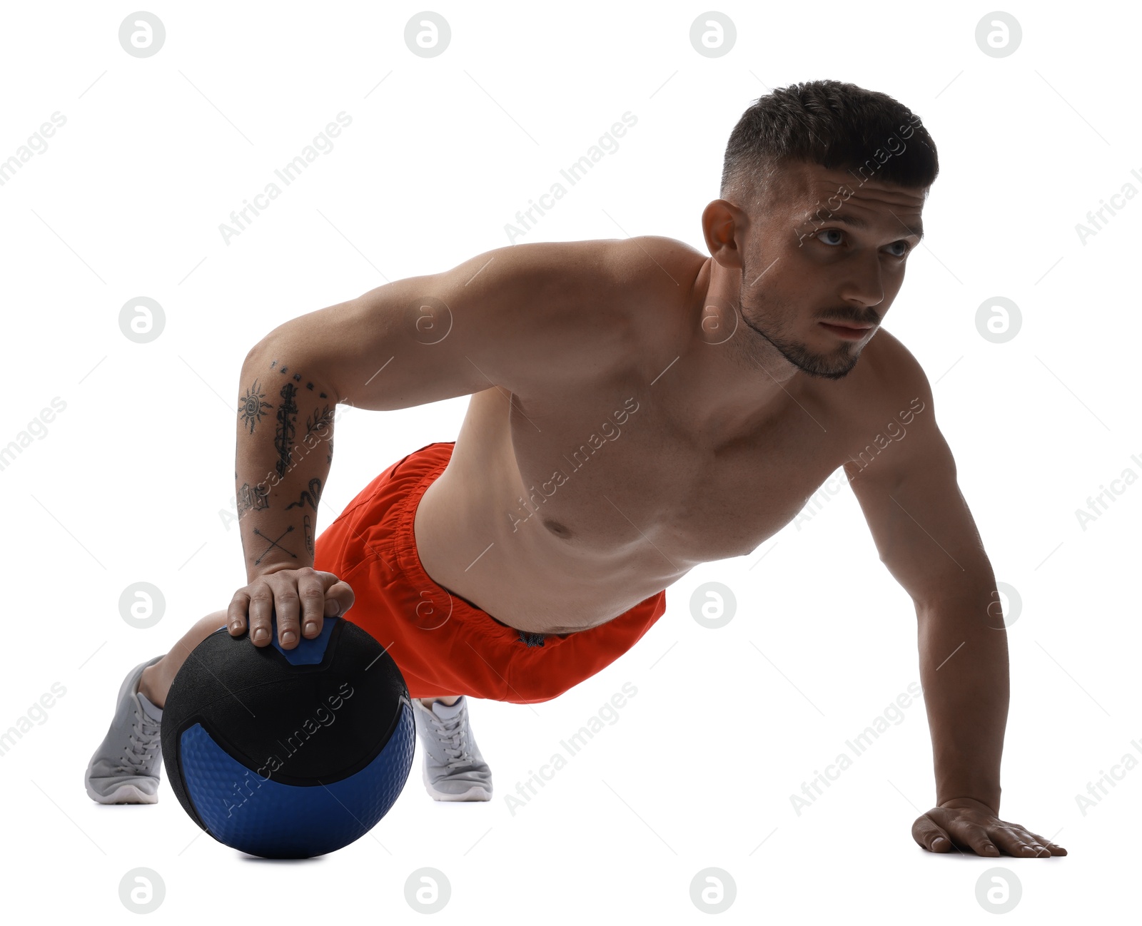 Man exercising with medicine ball on white background Photo of Man exercising with medicine ball on white background