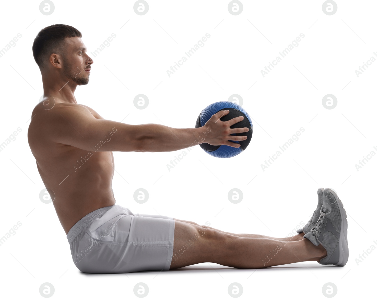 Man exercising with medicine ball on white background Photo of Man exercising with medicine ball on white background