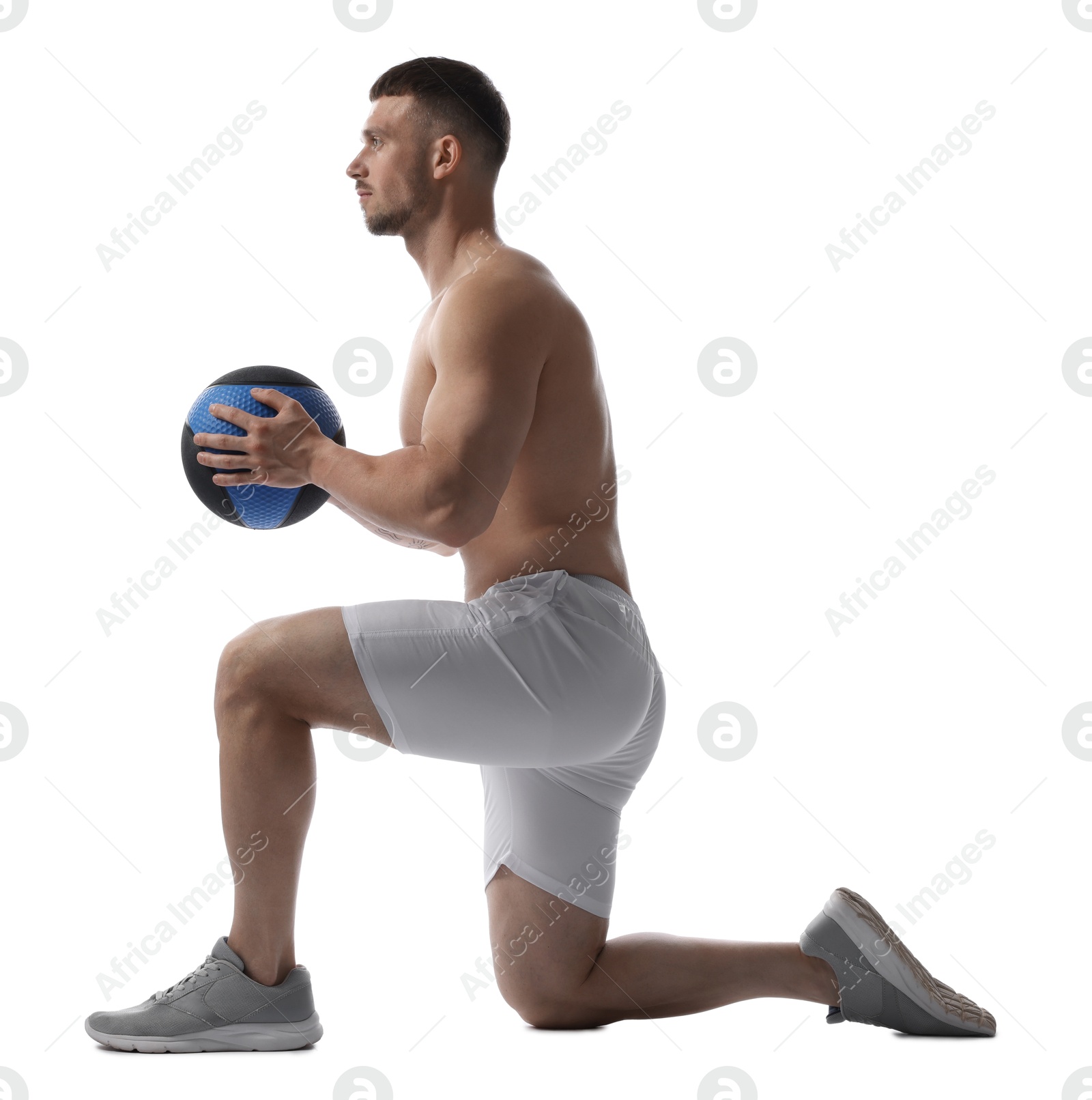 Man exercising with medicine ball on white background Photo of Man exercising with medicine ball on white background