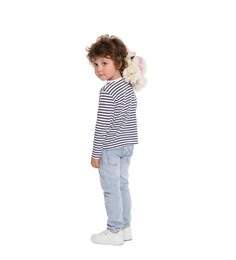Photo of Cute little boy with bouquet of beautiful peonies on white background, back view