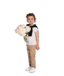 Photo of Cute little boy with bouquet of beautiful peonies on white background