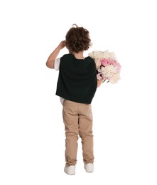 Photo of Cute little boy with bouquet of beautiful peonies on white background, back view