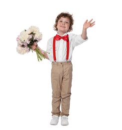 Photo of Cute little boy with bouquet of beautiful peonies waving on white background