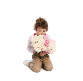 Photo of Cute little boy with bouquet of beautiful peonies on white background