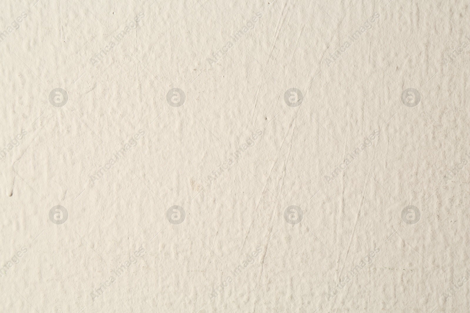 Beige textured surface as background, closeup view Photo of Beige textured surface as background, closeup view
