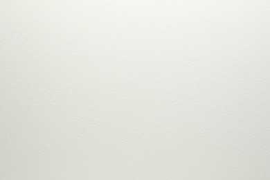 Photo of White textured surface as background, closeup view