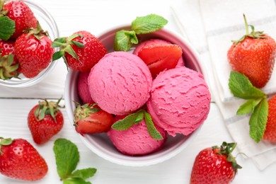 Photo of Tasty sorbet with strawberries and mint served on white wooden table, flat lay