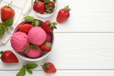 Photo of Tasty sorbet with strawberries and mint served on white wooden table, flat lay. Space for text