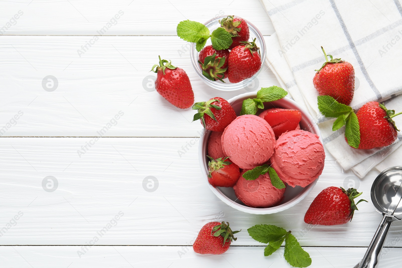 Tasty sorbet with strawberries and mint served on white wooden table, flat lay. Space for text Photo of Tasty sorbet with strawberries and mint served on white wooden table, flat lay. Space for text