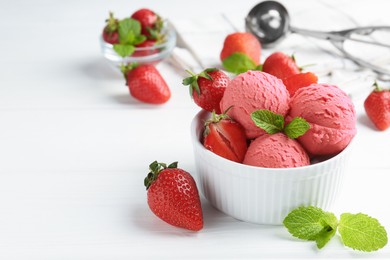 Photo of Tasty sorbet with strawberries and mint served on white wooden table, closeup. Space for text