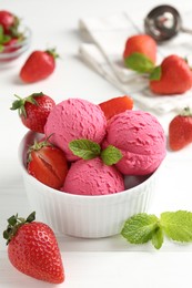 Photo of Tasty sorbet with strawberries and mint served on white wooden table, closeup