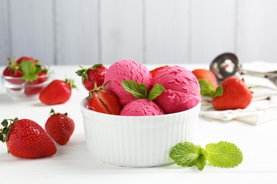 Photo of Tasty sorbet with strawberries and mint served on white wooden table, closeup