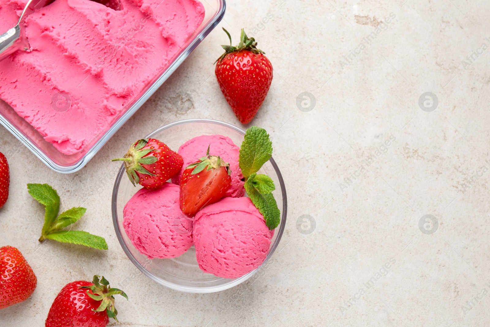 Tasty sorbet with strawberries and mint served on light table, flat lay. Space for text Photo of Tasty sorbet with strawberries and mint served on light table, flat lay. Space for text