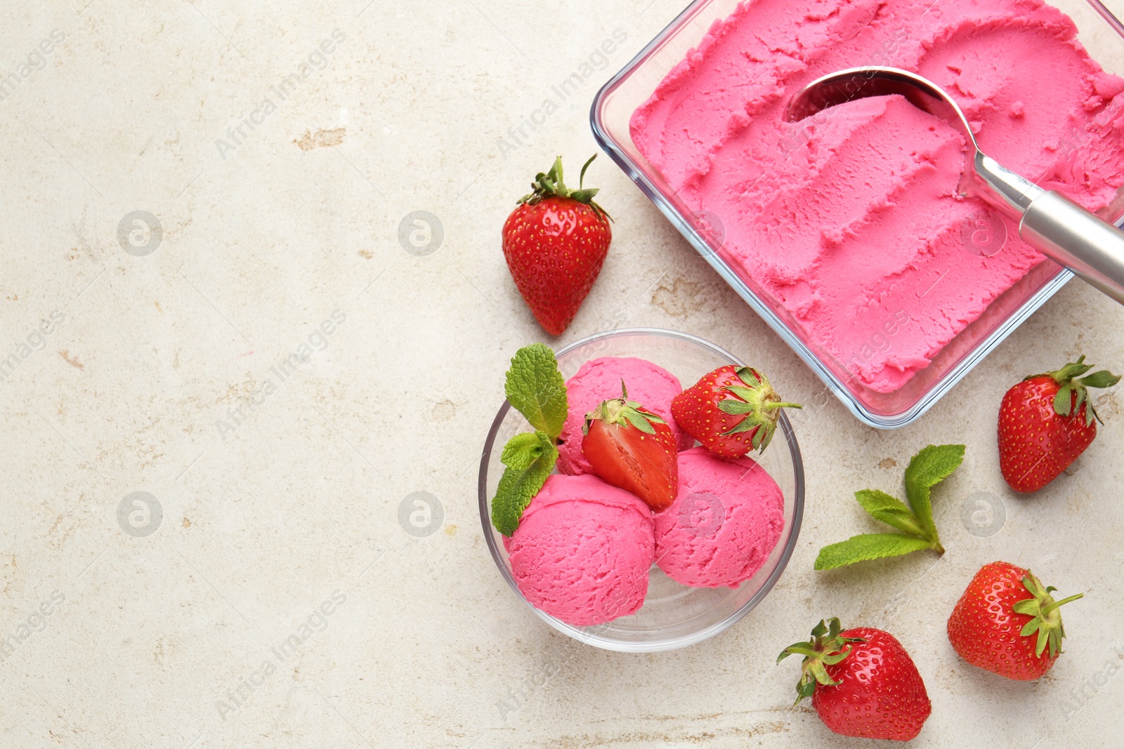 Photo of Tasty sorbet with strawberries and mint served on light table, flat lay. Space for text