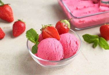Photo of Tasty sorbet with strawberries and mint served on light table, closeup