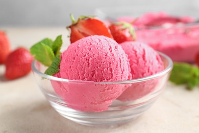 Photo of Tasty sorbet with strawberries and mint served on light table, closeup