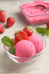 Photo of Tasty sorbet with strawberries and mint served on light table, closeup