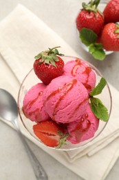 Photo of Tasty sorbet with strawberries and mint served on light table, flat lay