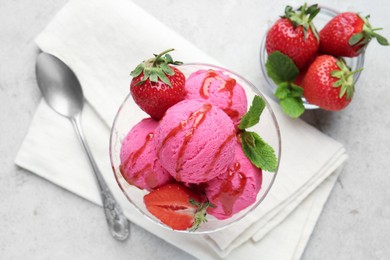 Photo of Tasty sorbet with strawberries and mint served on light table, flat lay
