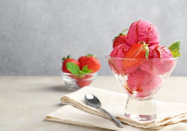 Photo of Tasty sorbet with strawberries and mint served on light table, closeup. Space for text