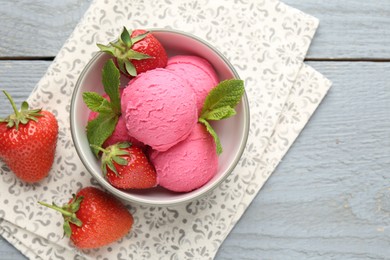 Photo of Tasty sorbet with strawberries and mint served on grey wooden table, flat lay. Space for text