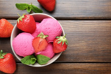 Photo of Tasty sorbet with strawberries and mint served on wooden table, flat lay. Space for text