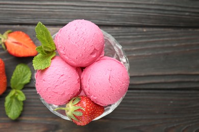 Photo of Tasty sorbet with strawberries and mint served on wooden table, flat lay. Space for text