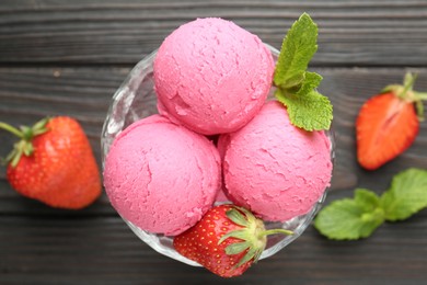 Photo of Tasty sorbet with strawberries and mint served on wooden table, flat lay
