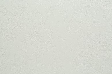 Photo of White textured surface as background, closeup view