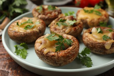 Photo of Many tasty stuffed mushrooms on table, closeup