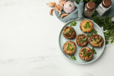 Photo of Tasty stuffed mushrooms and spices on white marble table, flat lay. Space for text