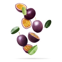 Image of Delicious ripe passion fruits and green leaves falling on white background
