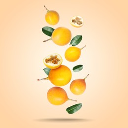 Image of Delicious ripe passion fruits with green leaves falling on pink beige gradient background