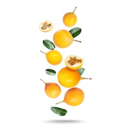 Image of Delicious ripe passion fruits and green leaves falling on white background